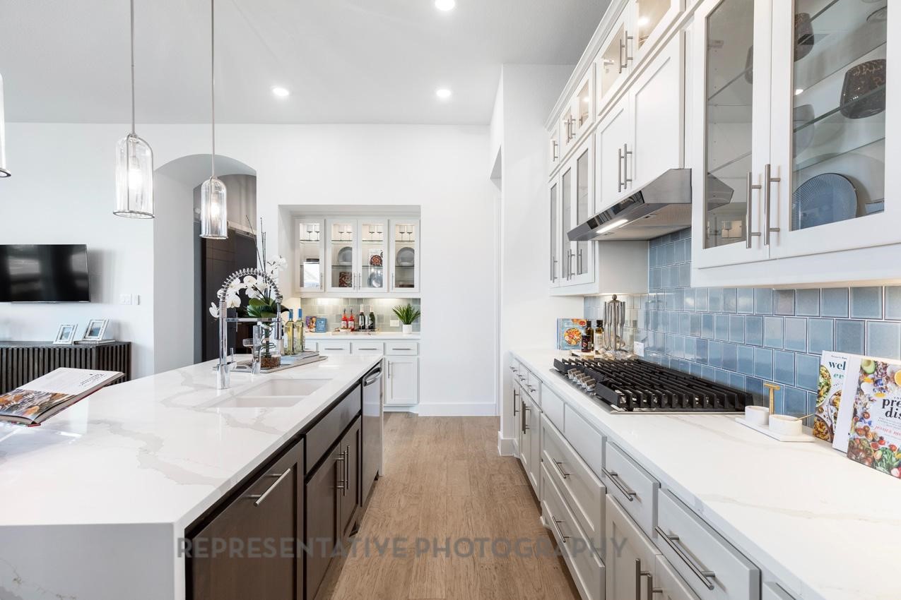 22214 Mount Whitney Road Waller, TX 77484 - Photo 9 of 50 a kitchen with a sink and stove