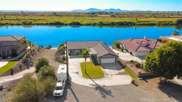 an aerial view of a house with a ocean view