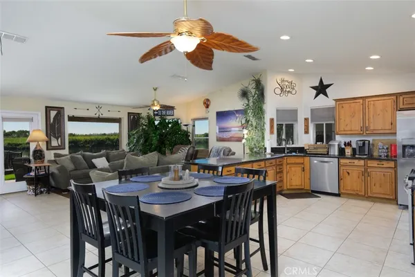 a kitchen with a table and chairs in it