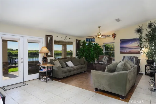 a bathroom with a granite countertop double vanity sink mirror and shower