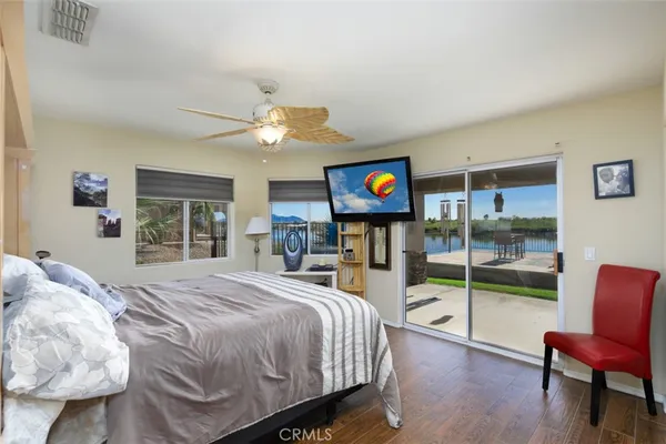 a bedroom with a bed and a chair