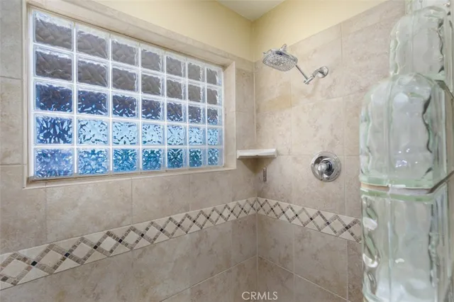 swimming pool view with a seating space