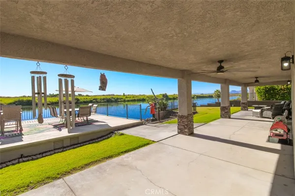 a view of a swimming pool with a patio