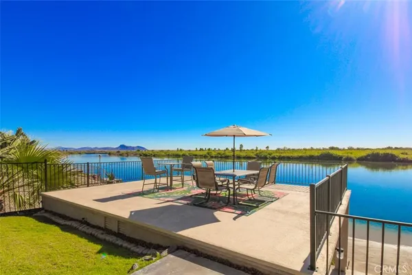 swimming pool view with a seating space