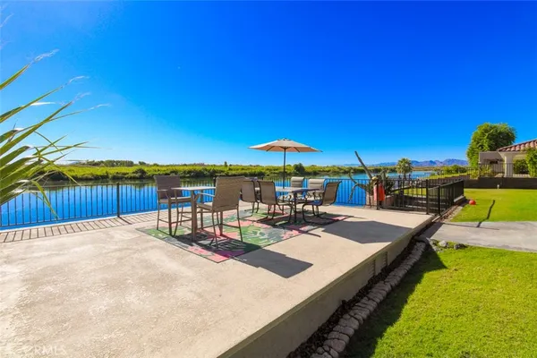 swimming pool view with a seating space