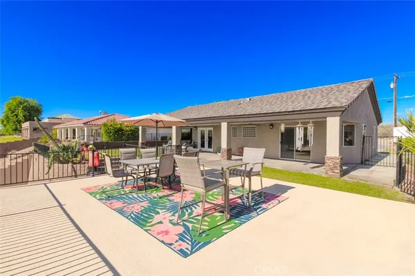 a view of a house with backyard porch and patio