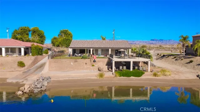 an aerial view of a house with a swimming pool