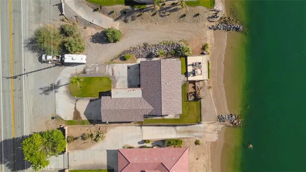 an aerial view of a house with a swimming pool