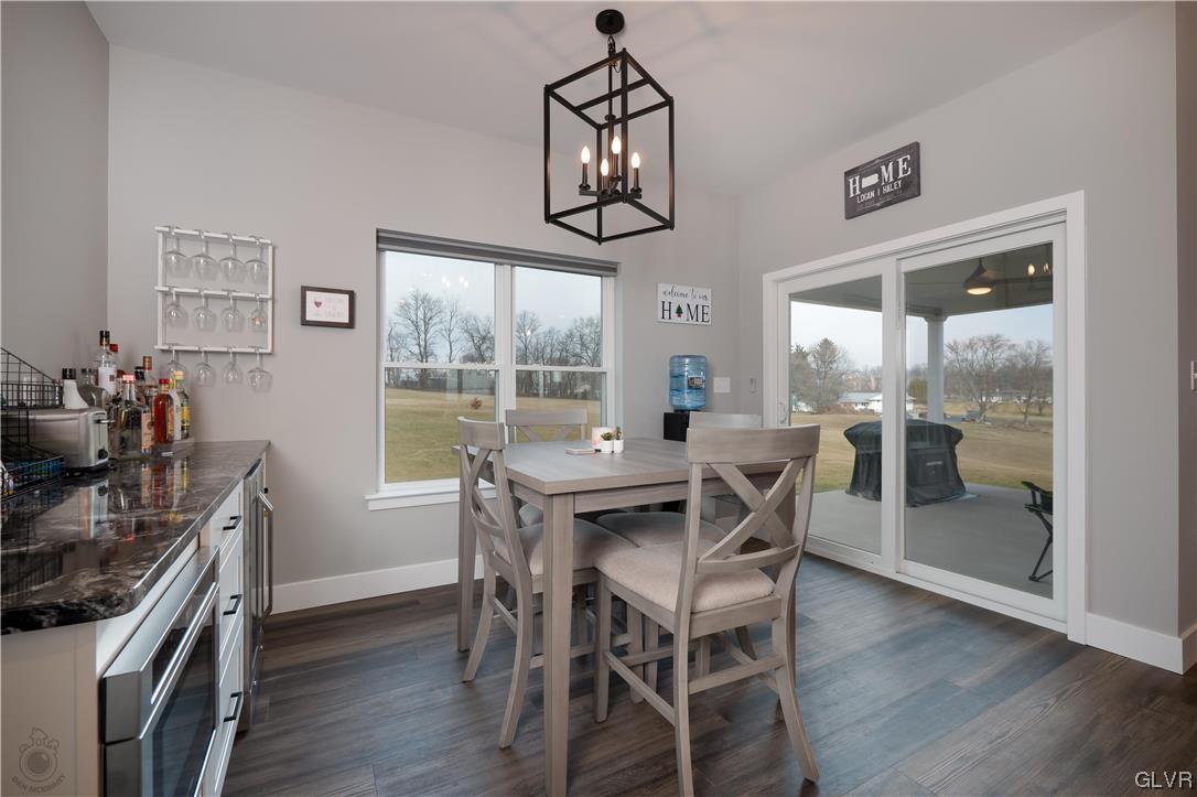 785 Emerald Valley Lane Bangor, PA 18013 - Photo 11 of 28 a view of a dining room with furniture window and wooden floor