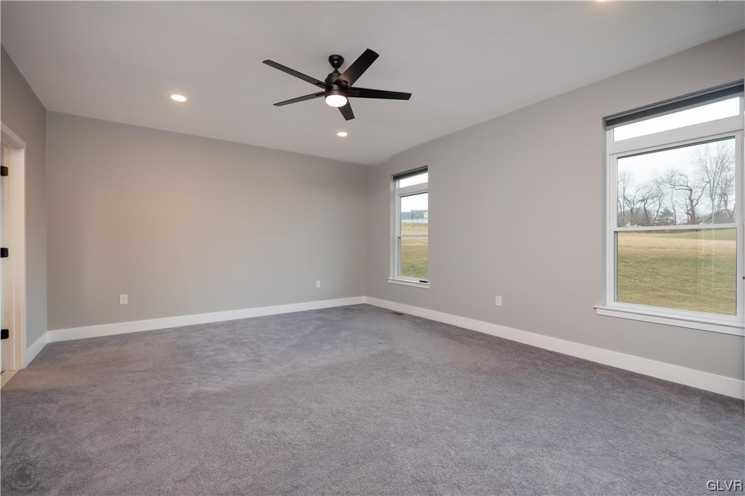 785 Emerald Valley Lane Bangor, PA 18013 - Photo 12 of 28 an empty room with a window and a fan