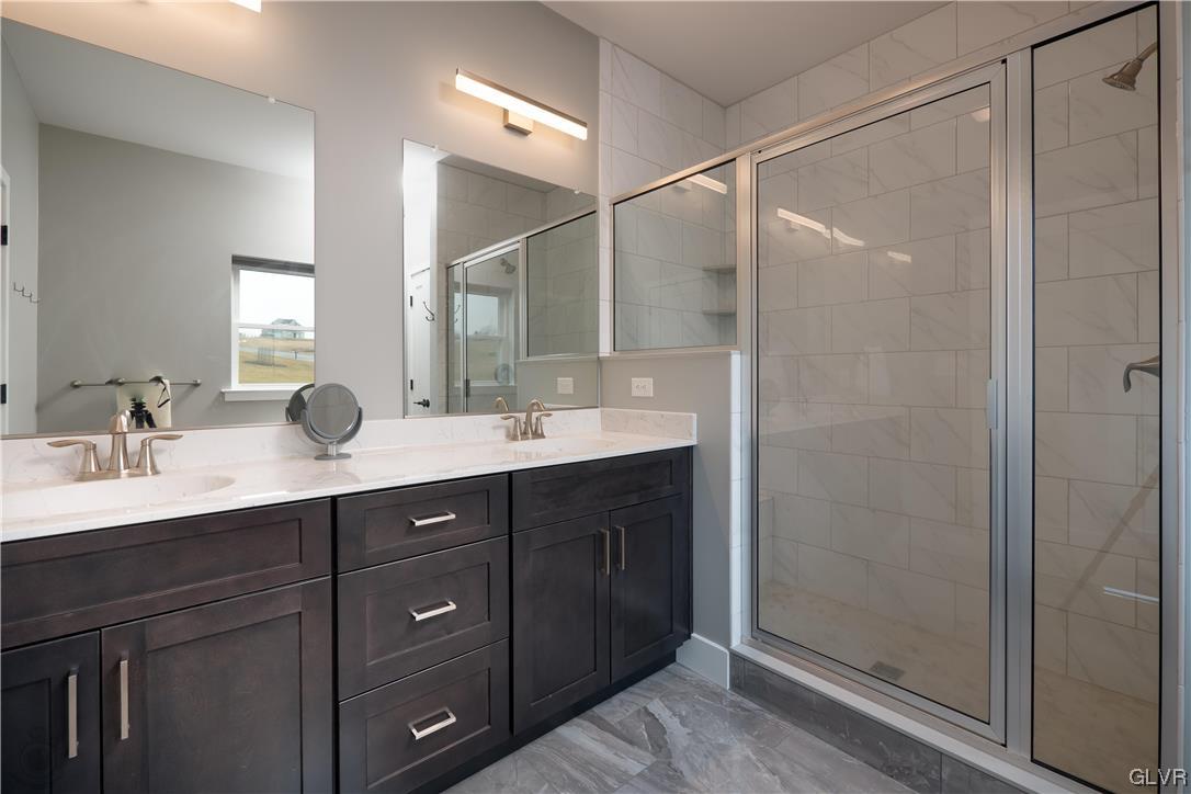 785 Emerald Valley Lane Bangor, PA 18013 - Photo 14 of 28 a bathroom with a double vanity sink mirror and shower
