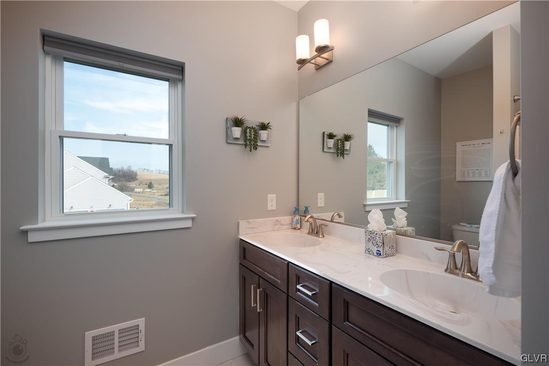 785 Emerald Valley Lane Bangor, PA 18013 - Photo 16 of 28 a bathroom with a double vanity sink and a mirror
