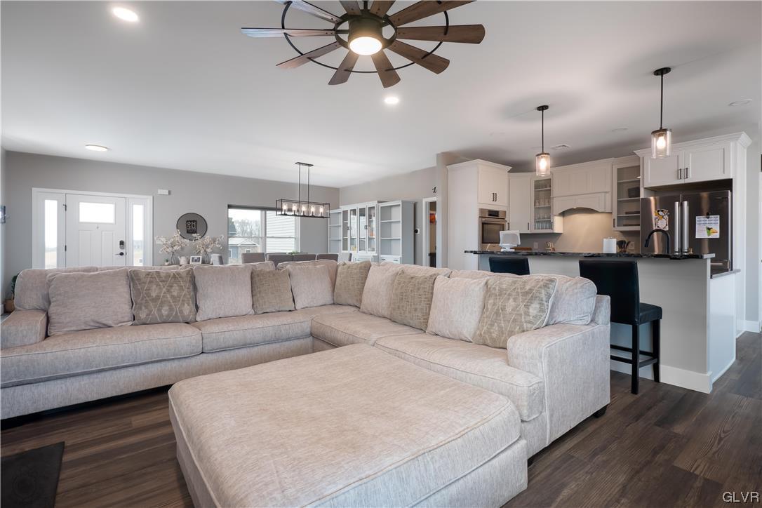 785 Emerald Valley Lane Bangor, PA 18013 - Photo 7 of 28 a living room with furniture kitchen view and a chandelier