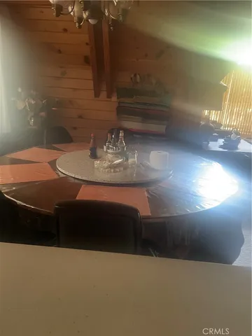 a view of a chair and table in the balcony