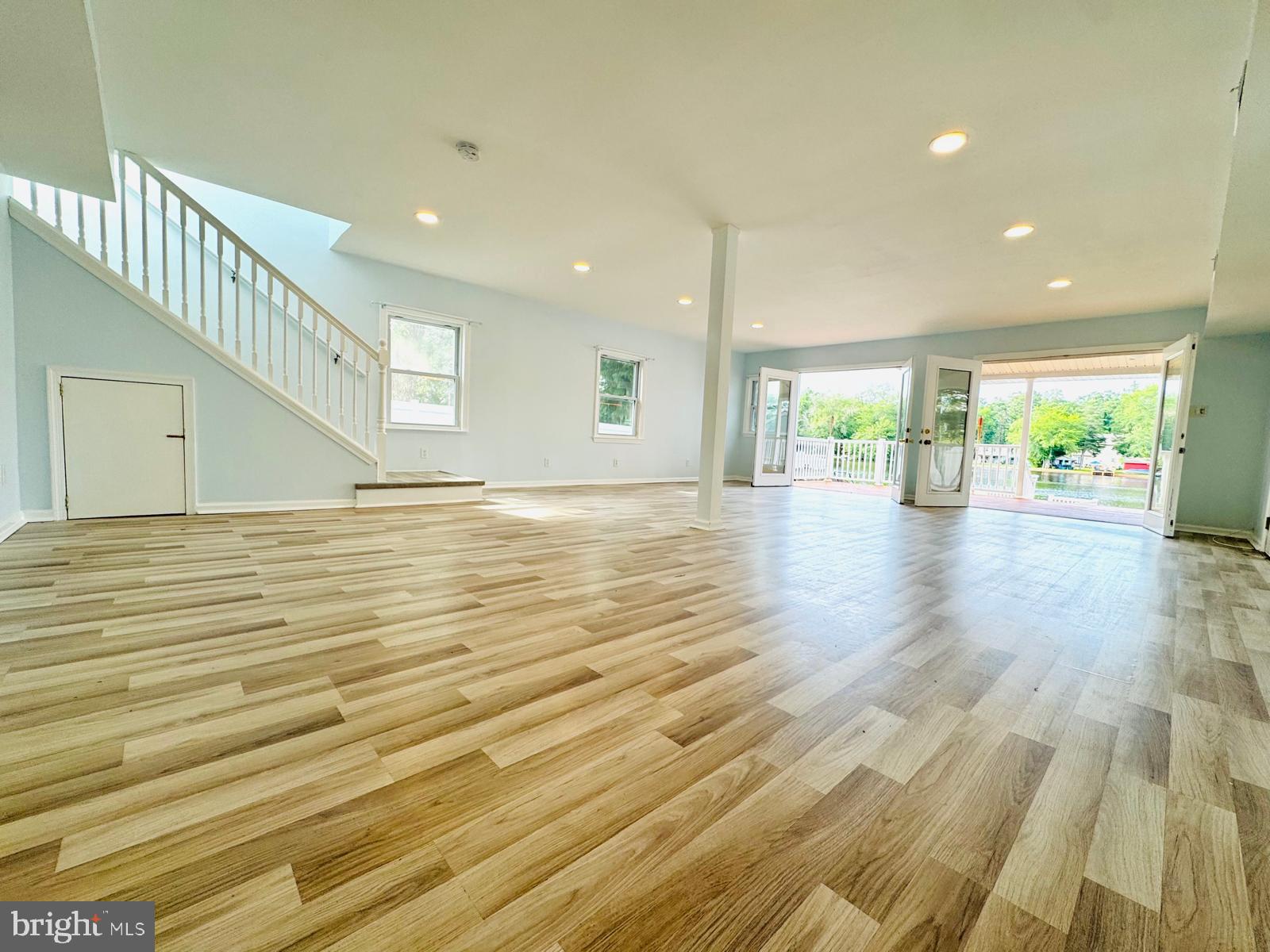 3614 Lakeside Drive Williamstown, NJ 08094 - Photo 2 of 40 a view of an empty room with wooden floor and a window