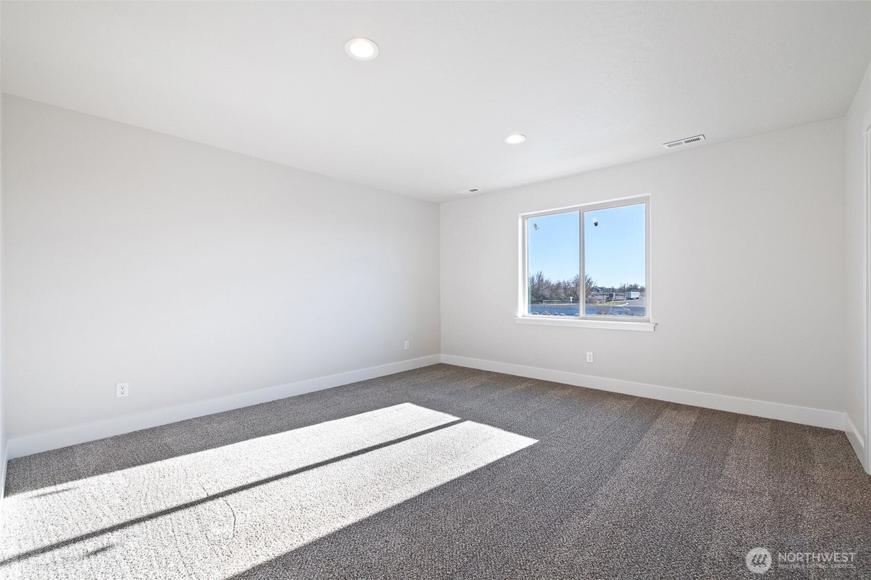 4247 Sandy Street Moses Lake, WA 98837 - Photo 18 of 24 an empty room with a empty space and window