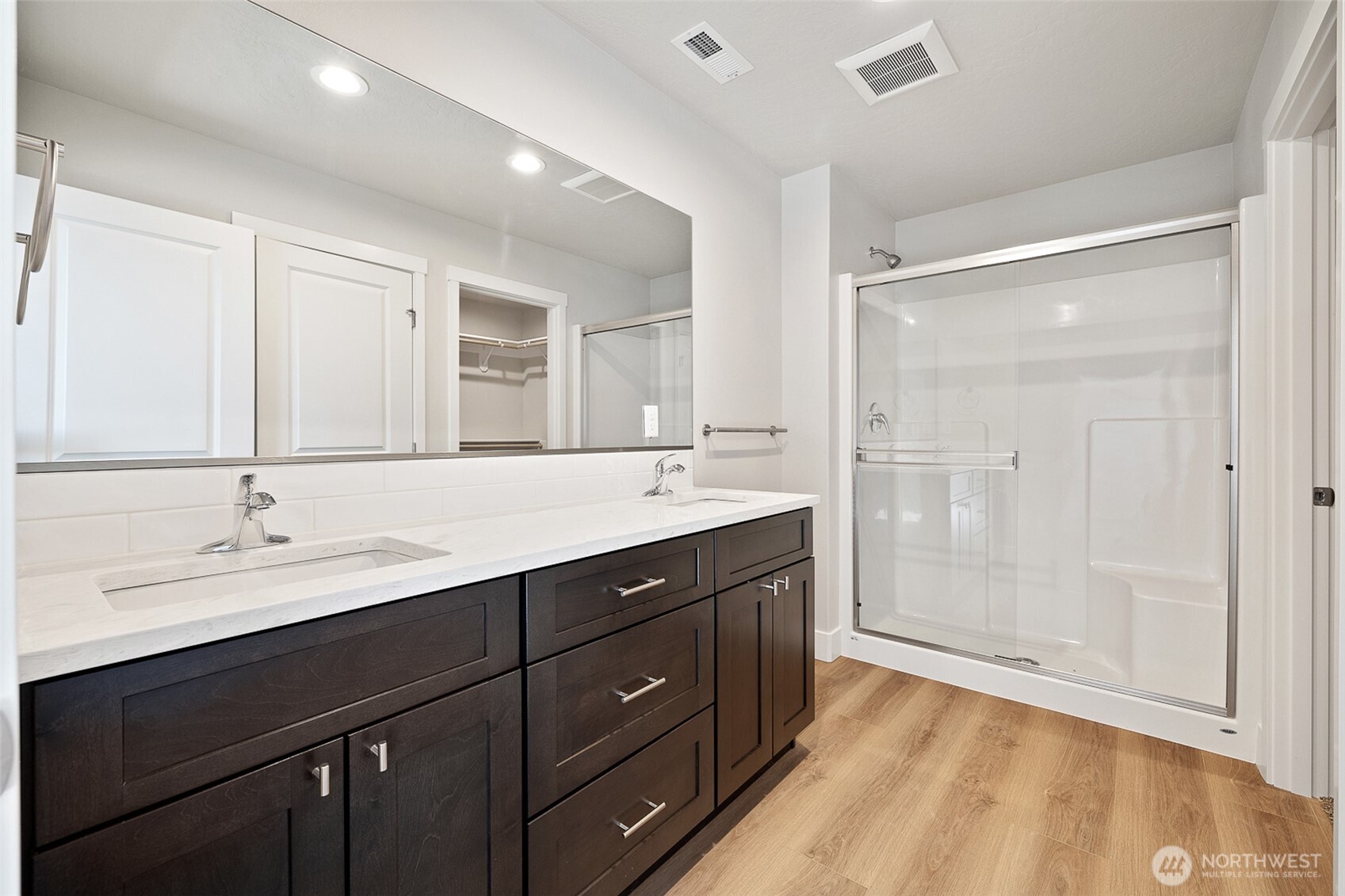 4247 Sandy Street Moses Lake, WA 98837 - Photo 20 of 24 a bathroom with a double vanity sink mirror and shower