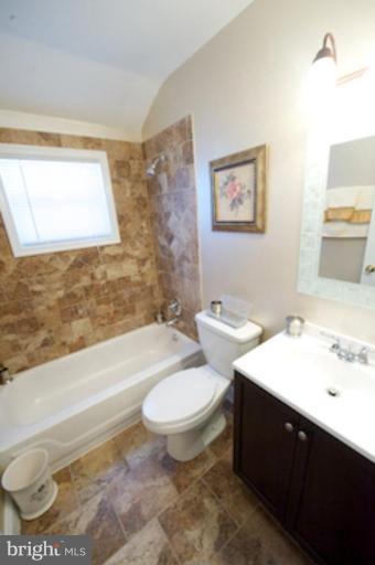 1968 Haselmere Road Dundalk, MD 21222 - Photo 7 of 16 a bathroom with a toilet a sink and bathtub