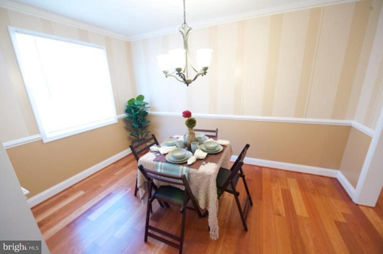 1968 Haselmere Road Dundalk, MD 21222 - Photo 10 of 16 a view of a dining room with furniture and wooden floor
