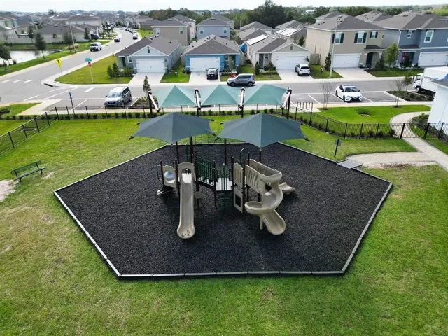 an aerial view of a house with outdoor space