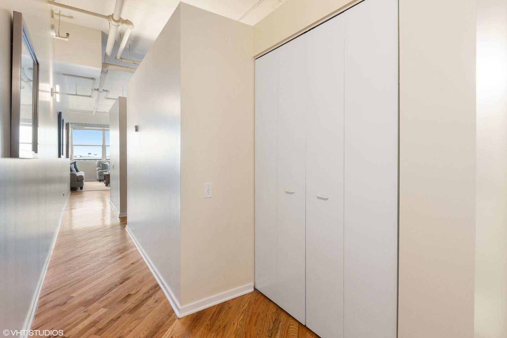 500 South Clinton Street, Unit 722 Chicago, IL 60607 - Photo 14 of 21 a view of a hallway with wooden floor