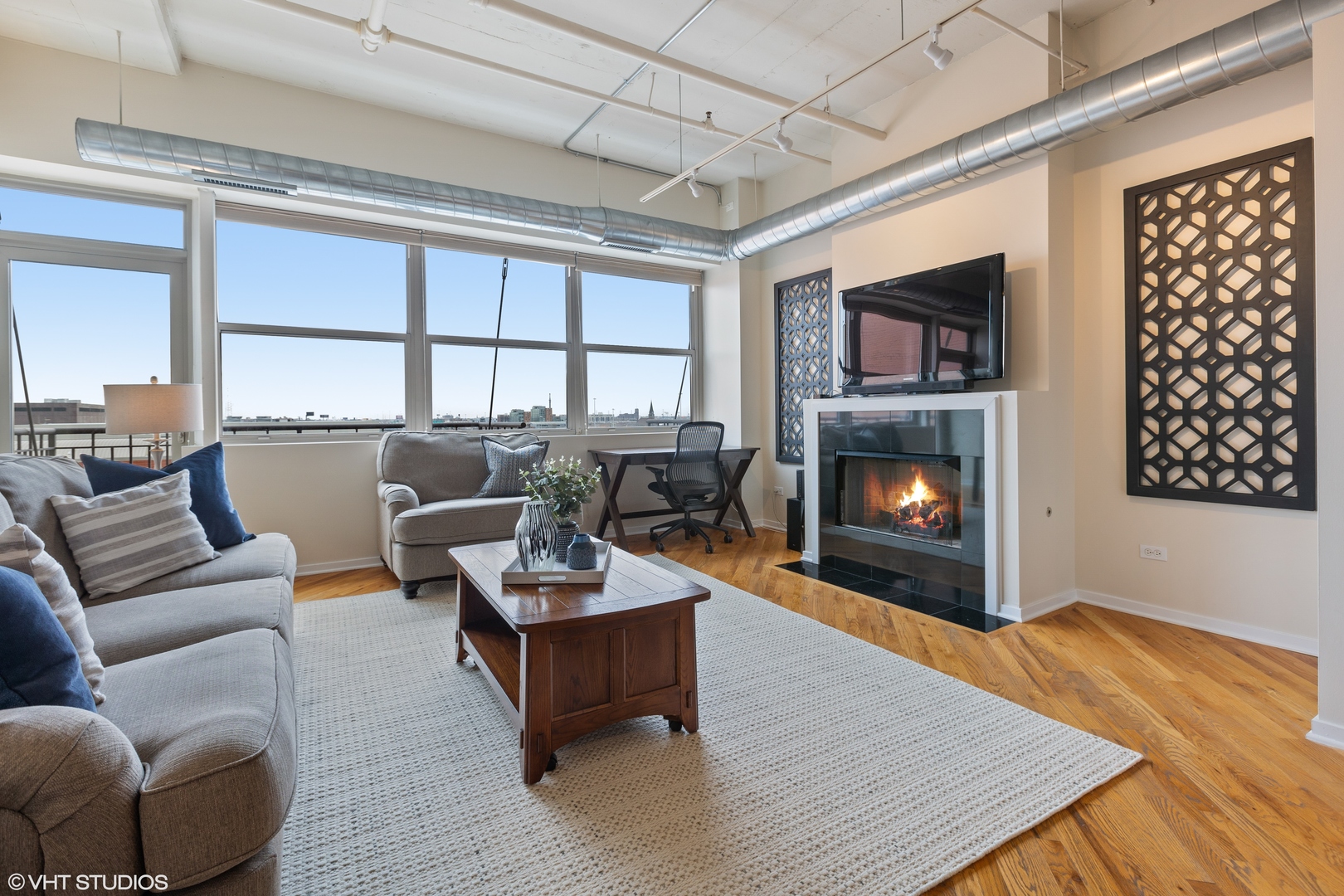 500 South Clinton Street, Unit 722 Chicago, IL 60607 - Photo 4 of 21 a living room with furniture and a fireplace
