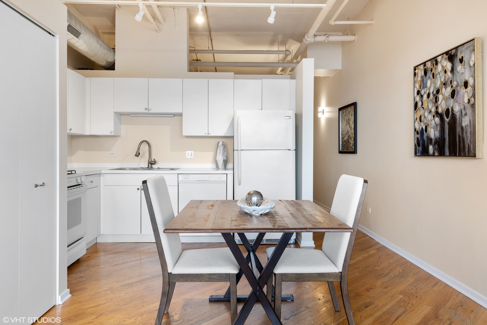 500 South Clinton Street, Unit 722 Chicago, IL 60607 - Photo 8 of 21 a view of a dining room with furniture and wooden floor