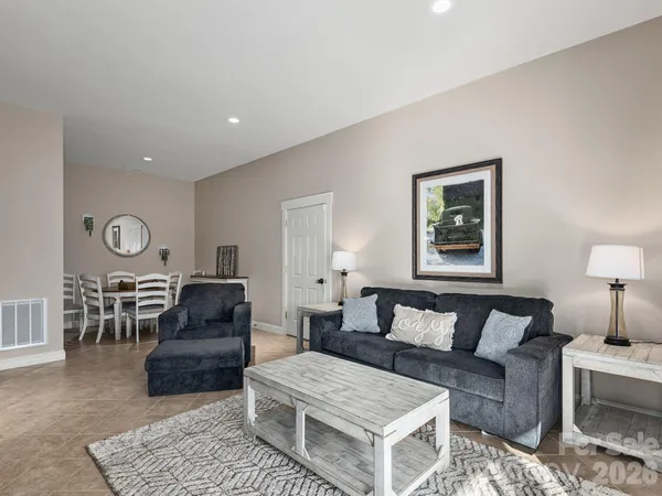 a bedroom with a bed and ceiling fan