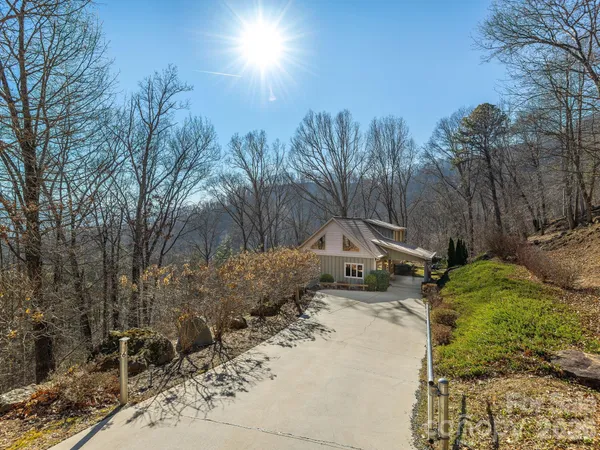 a kitchen with a table chairs refrigerator and cabinets