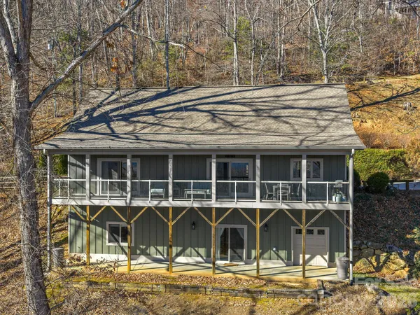 a view of a chairs and table in the balcony
