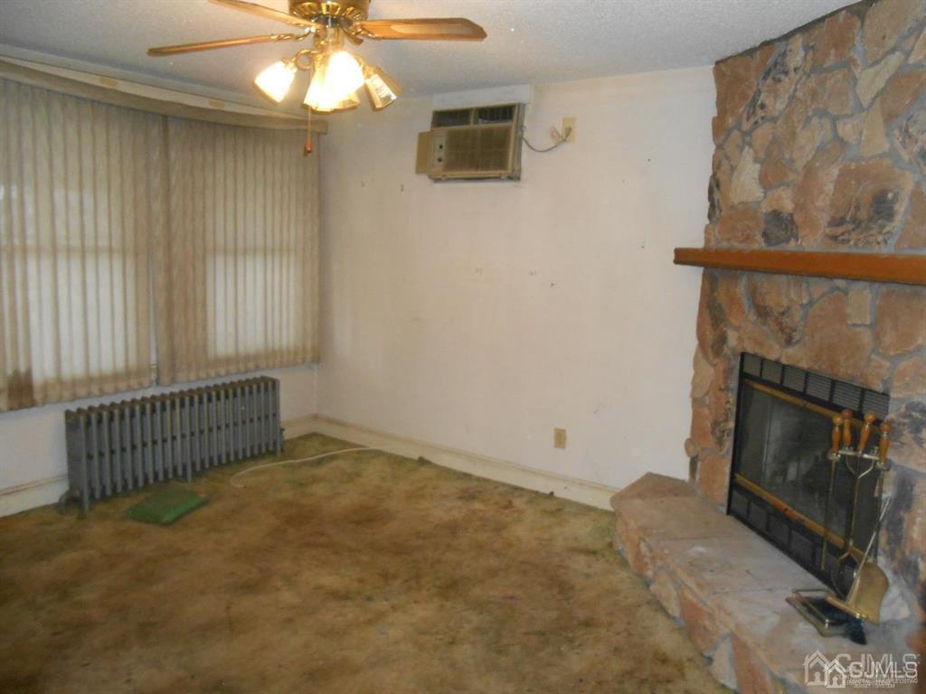 48 Frederick Street Carteret, NJ 07008 - Photo 7 of 16 a view of an empty room with a fireplace