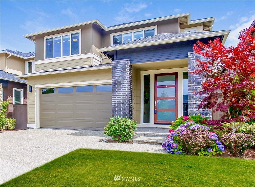 4108 168th Place Southeast Bothell, WA 98012 - Photo 1 of 39 a front view of a house with a yard and garage