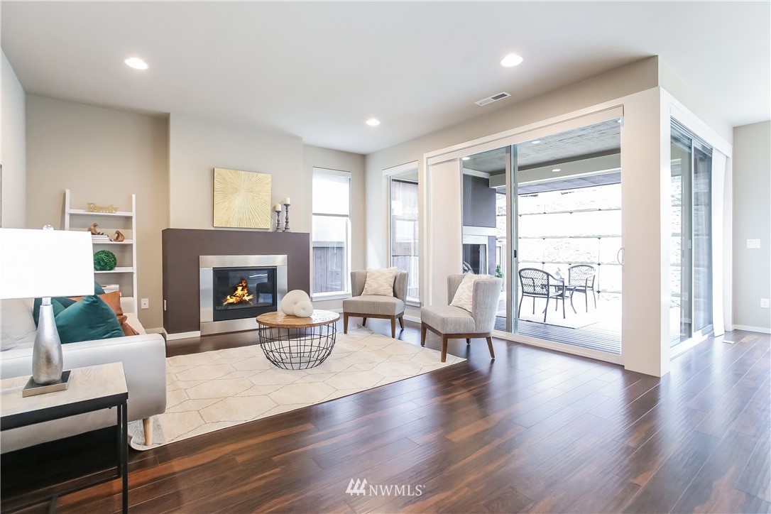 4108 168th Place Southeast Bothell, WA 98012 - Photo 3 of 39 a living room with furniture and a fireplace
