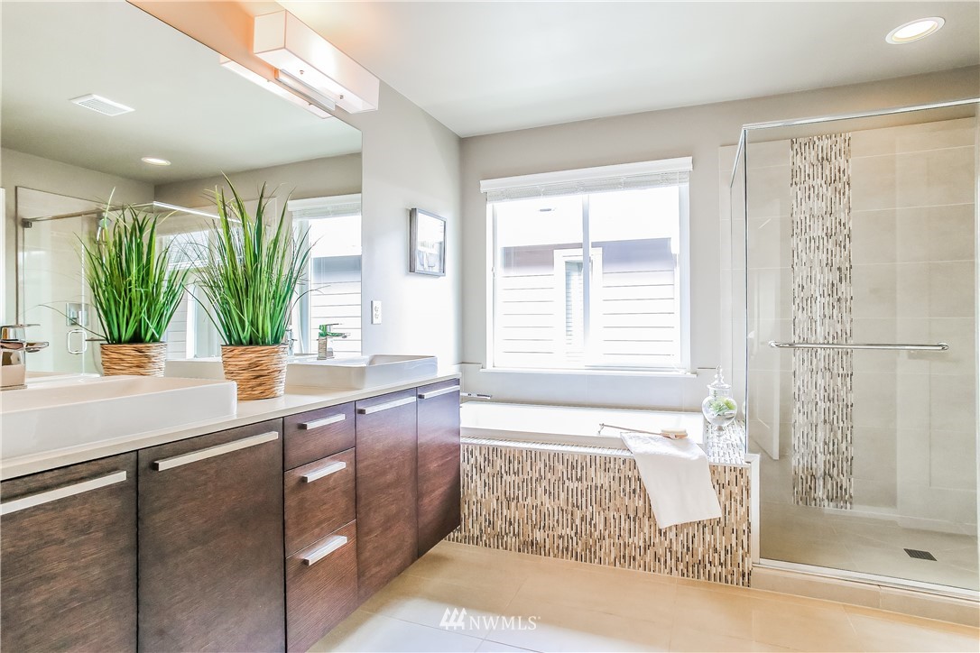 4108 168th Place Southeast Bothell, WA 98012 - Photo 23 of 39 a bathroom with a tub sink and mirror