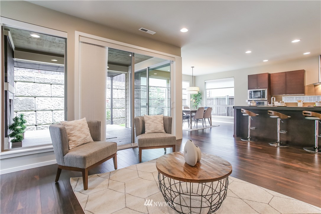 4108 168th Place Southeast Bothell, WA 98012 - Photo 5 of 39 a living room with furniture and a large window