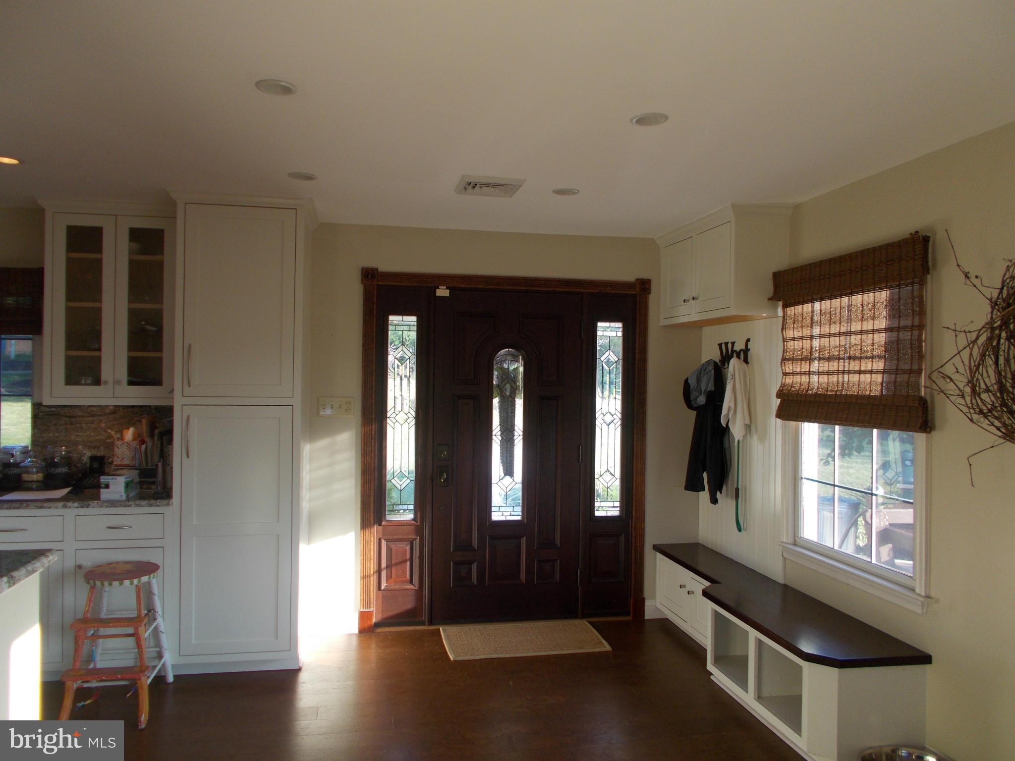 15712 Spade Road Hagerstown, MD 21740 - Photo 11 of 30 a hallway with wooden floor and windows