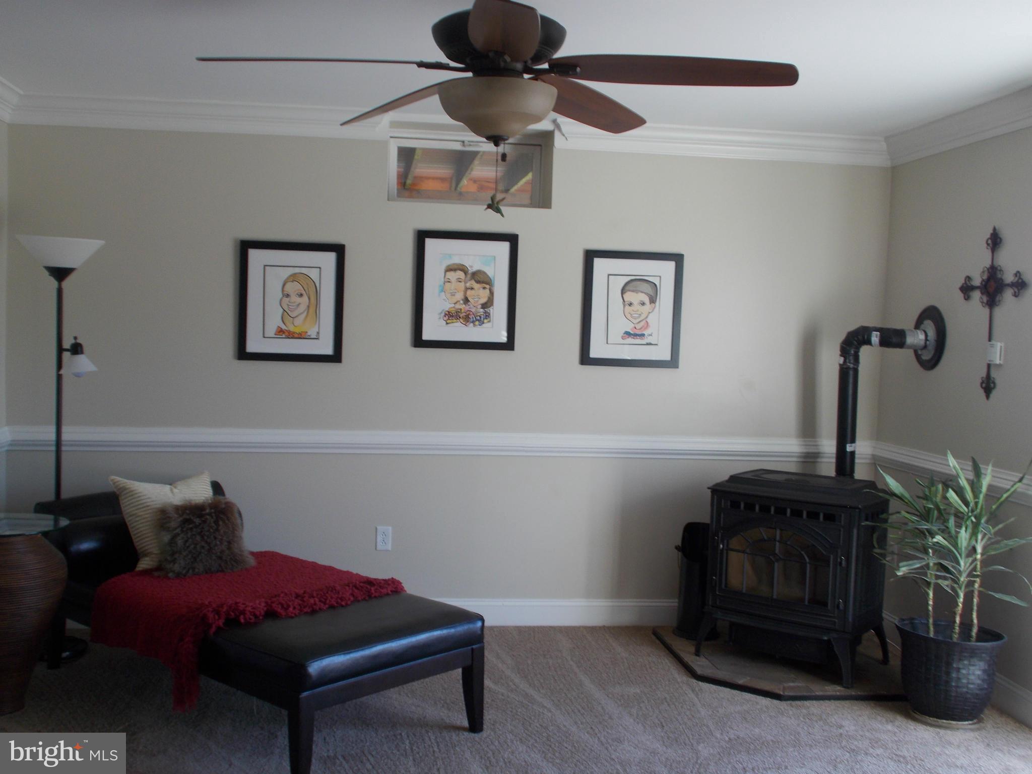 15712 Spade Road Hagerstown, MD 21740 - Photo 19 of 30 a room with furniture and a chandelier fan