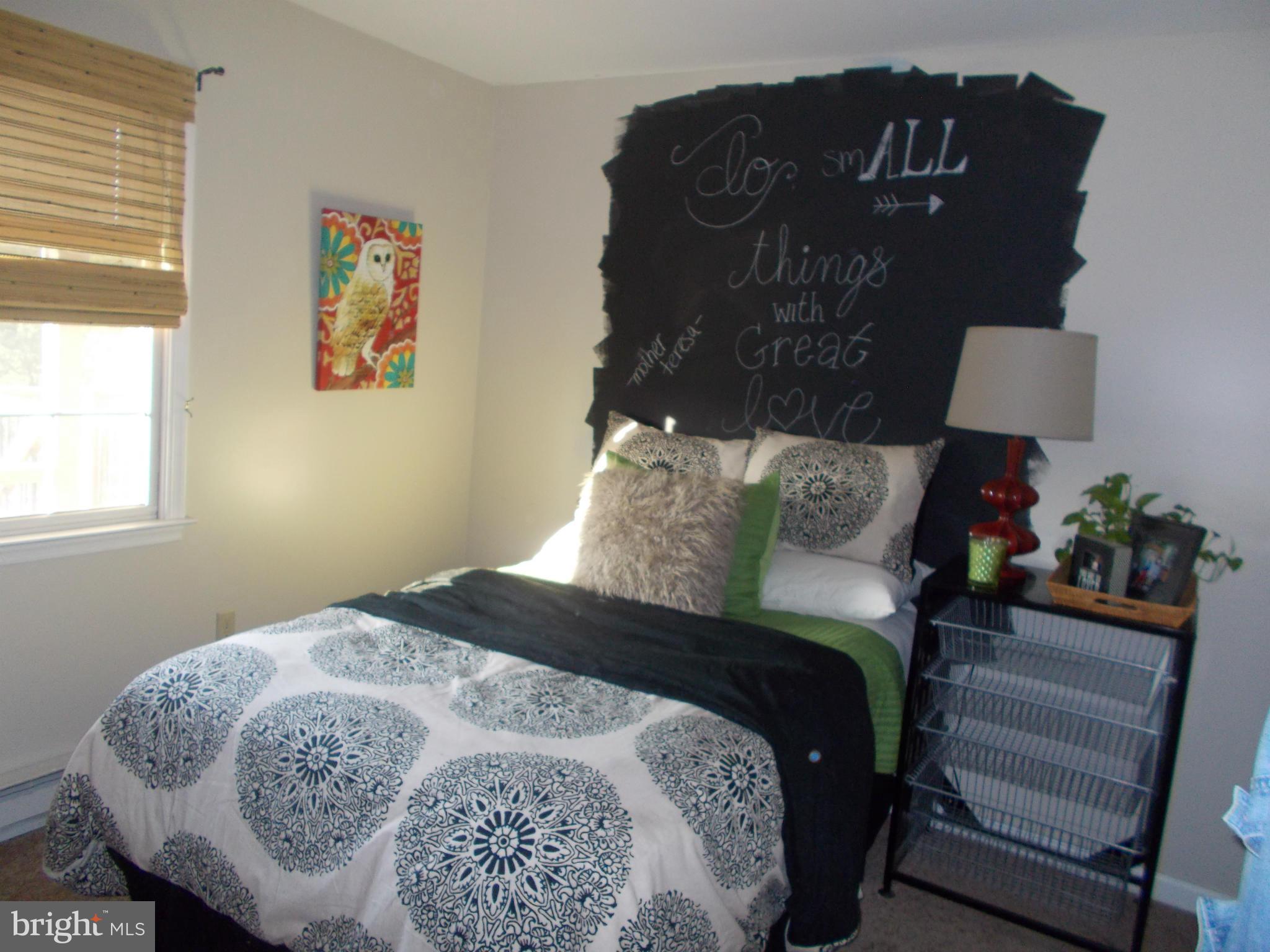 15712 Spade Road Hagerstown, MD 21740 - Photo 22 of 30 a bedroom with a bed and a lamp on dresser