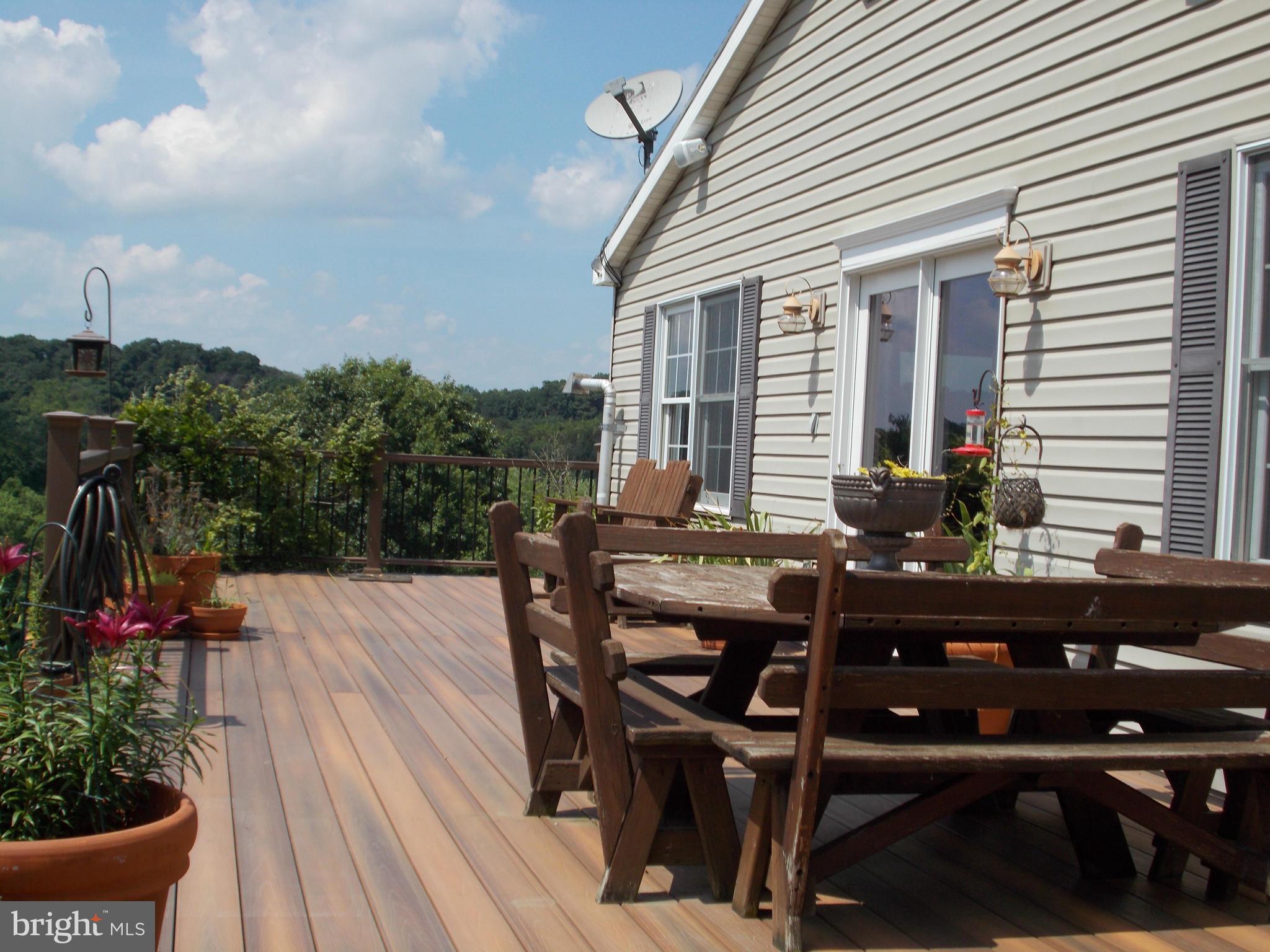 15712 Spade Road Hagerstown, MD 21740 - Photo 27 of 30 a view of a dinning table and chairs in patio of the house