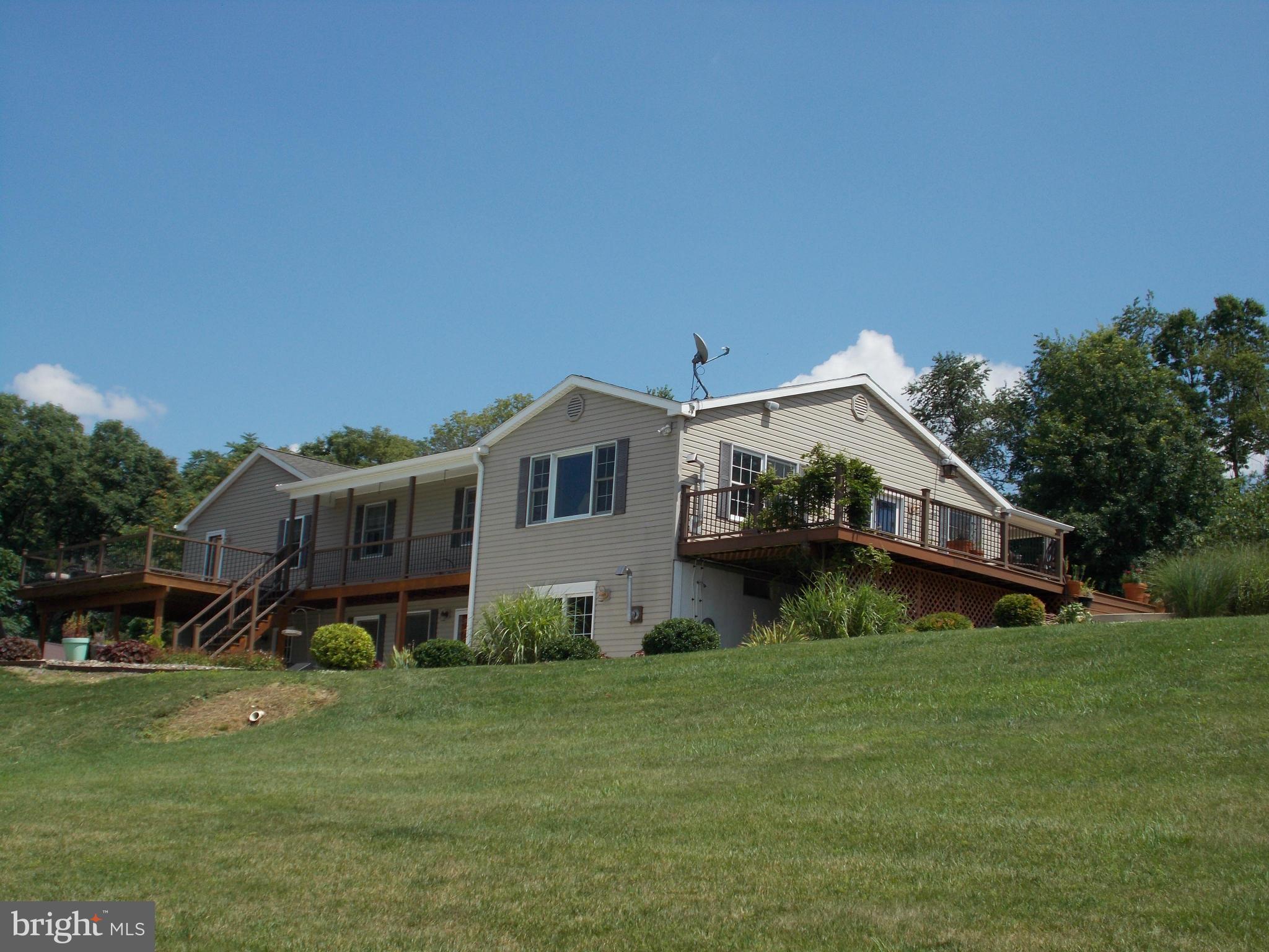 15712 Spade Road Hagerstown, MD 21740 - Photo 4 of 30 a front view of house with garden