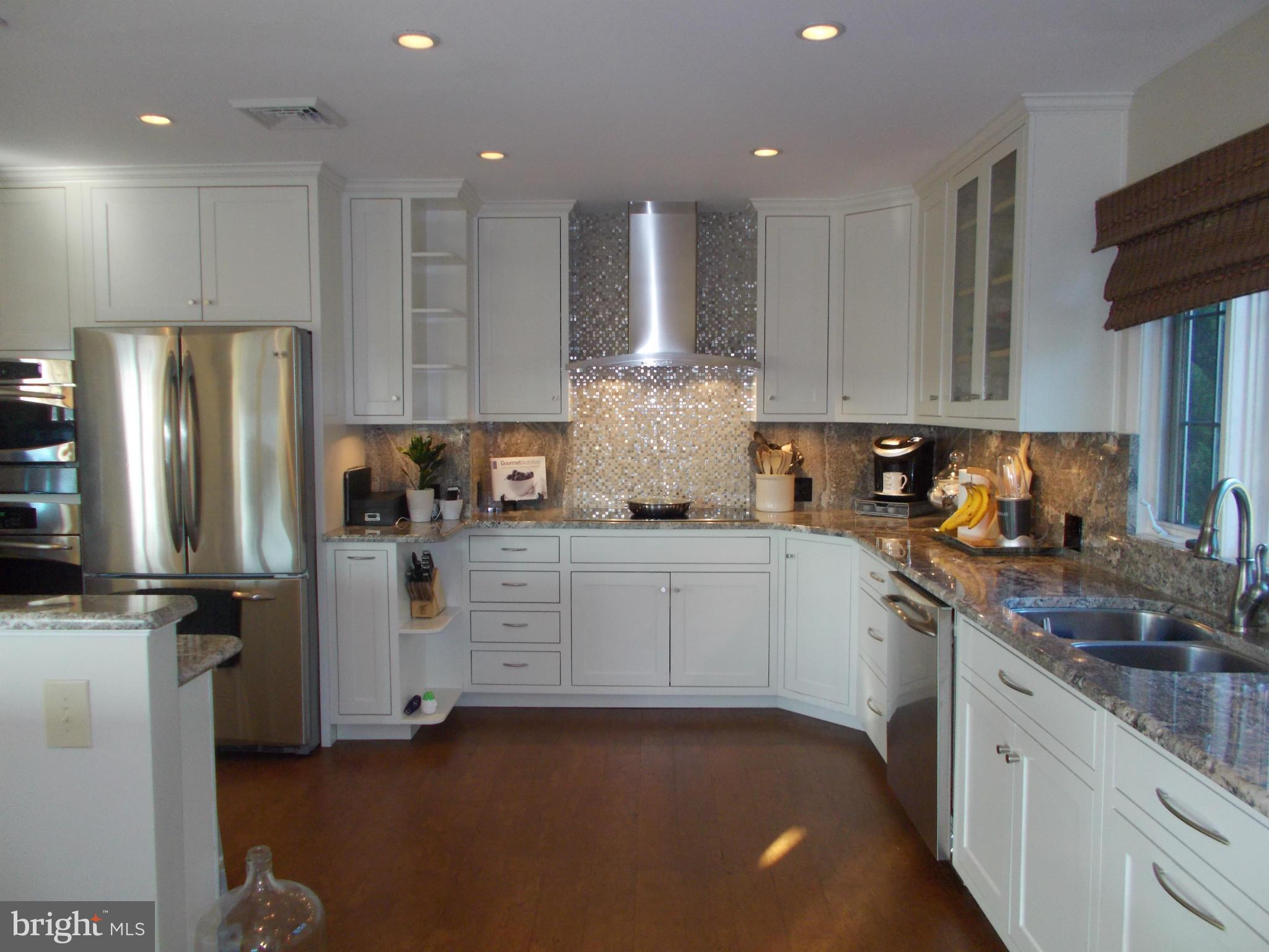 15712 Spade Road Hagerstown, MD 21740 - Photo 7 of 30 a kitchen with stainless steel appliances granite countertop a refrigerator sink and stove