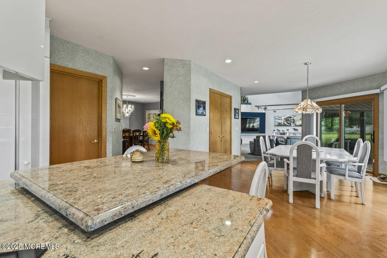 31 Thompson Grove Road Freehold, NJ 07728 - Photo 22 of 54 a living room with dining room and wooden floor