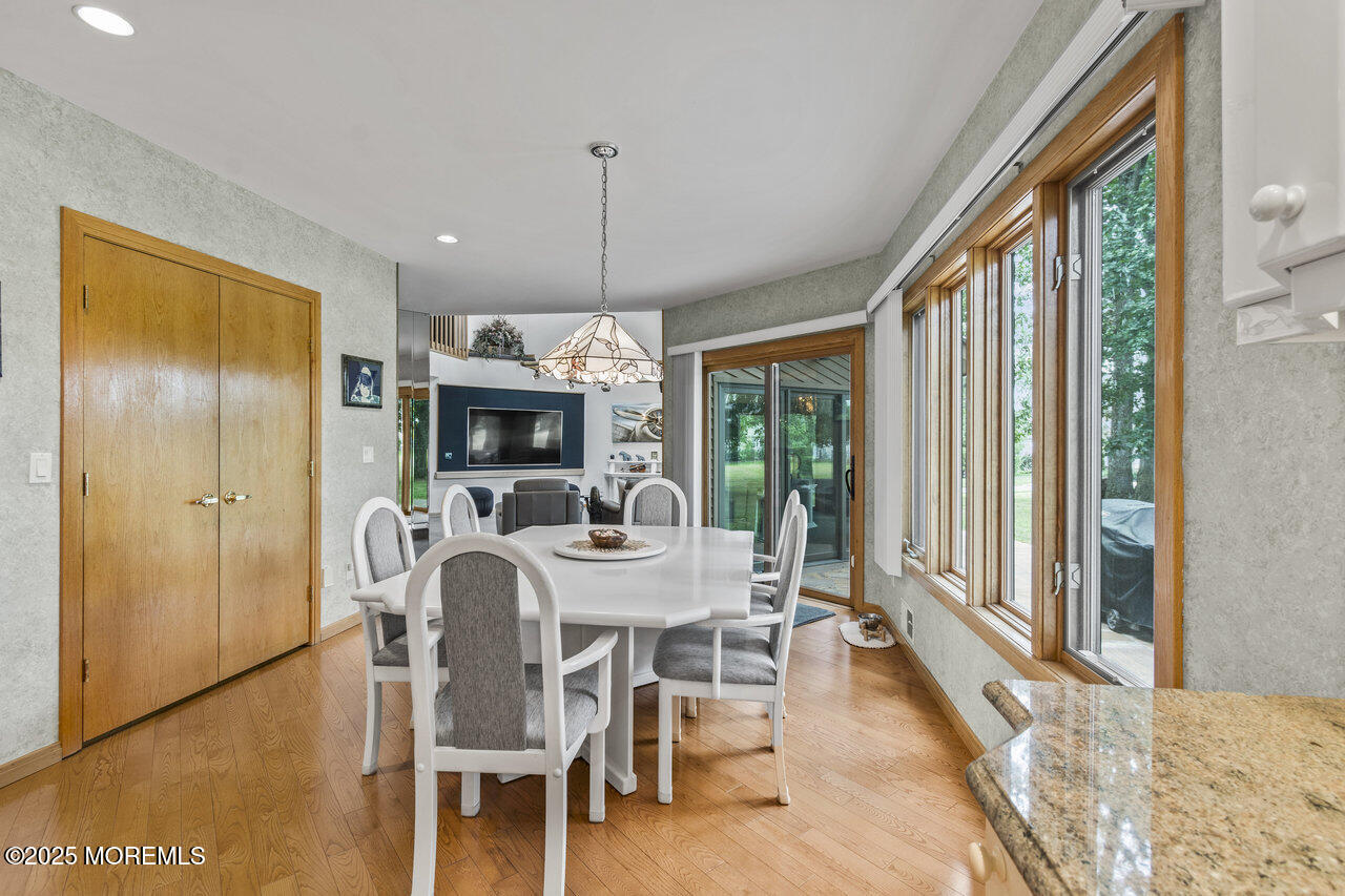 31 Thompson Grove Road Freehold, NJ 07728 - Photo 23 of 54 a view of a dining room with furniture window and wooden floor