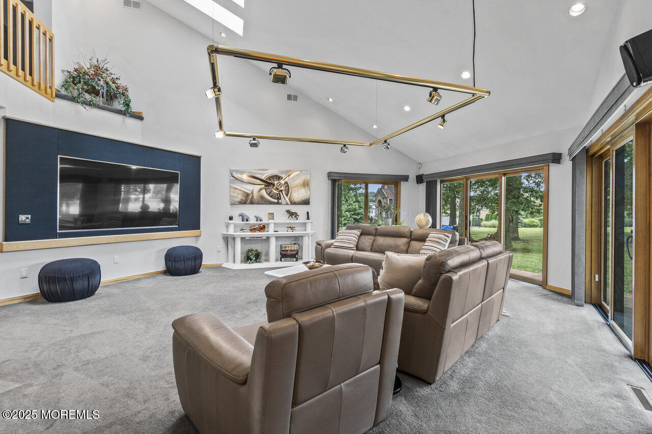 31 Thompson Grove Road Freehold, NJ 07728 - Photo 26 of 54 a living room with furniture a flat screen tv and a window