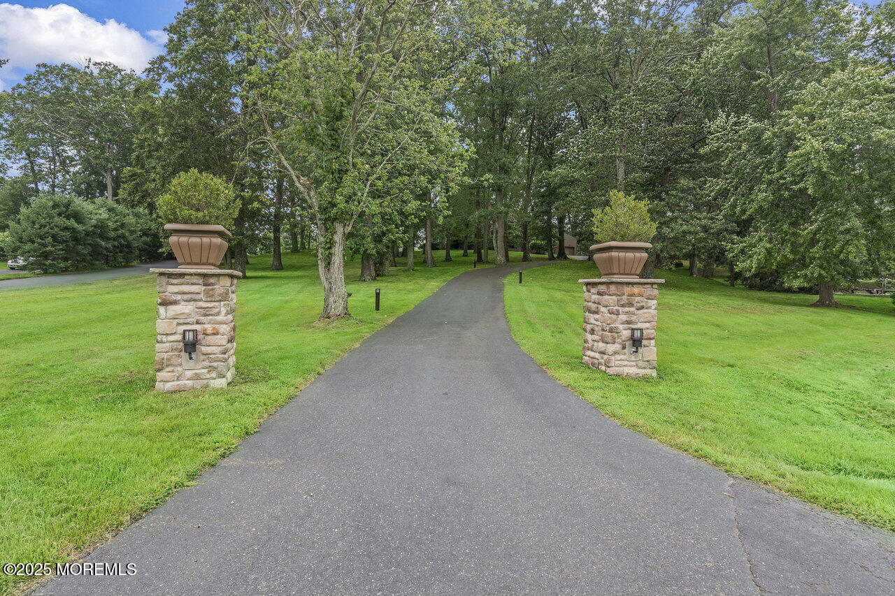 31 Thompson Grove Road Freehold, NJ 07728 - Photo 3 of 54 a front view of a house with a yard and a street