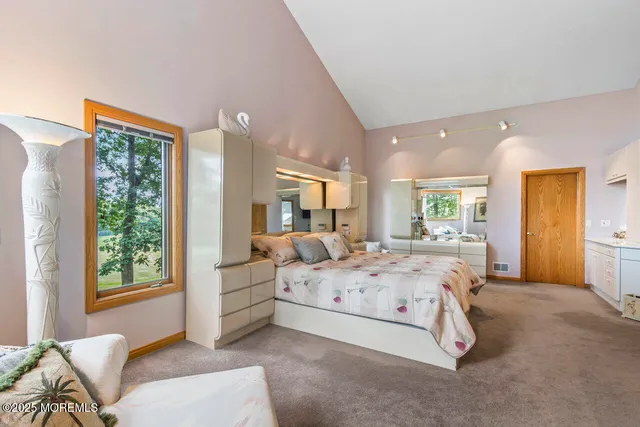 a spacious bathroom with a sink and a large mirror