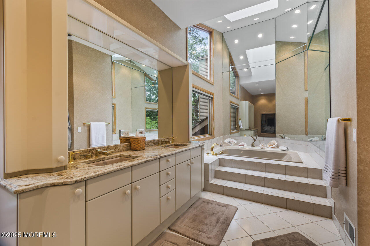 31 Thompson Grove Road Freehold, NJ 07728 - Photo 37 of 54 a spacious bathroom with a mirror and sink