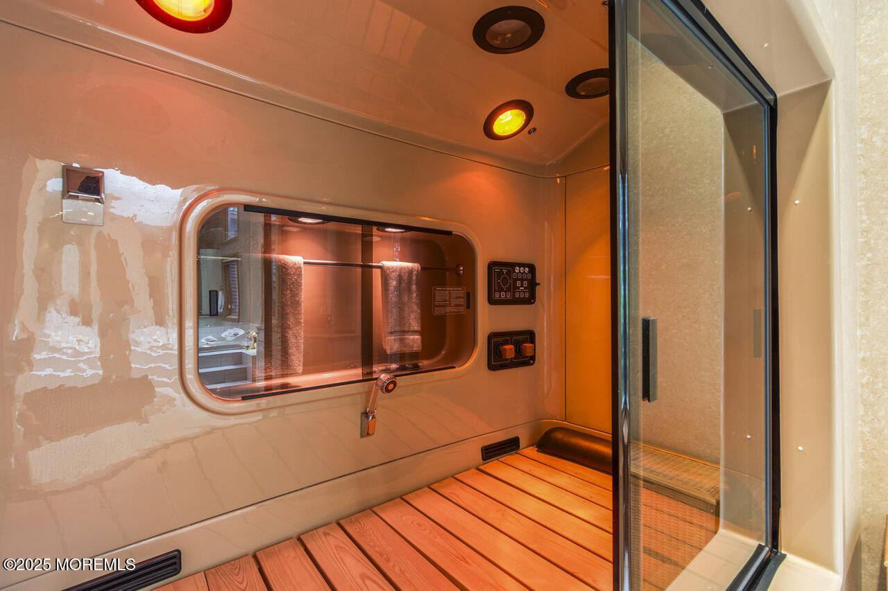 31 Thompson Grove Road Freehold, NJ 07728 - Photo 38 of 54 a bathroom with a mirror and shower
