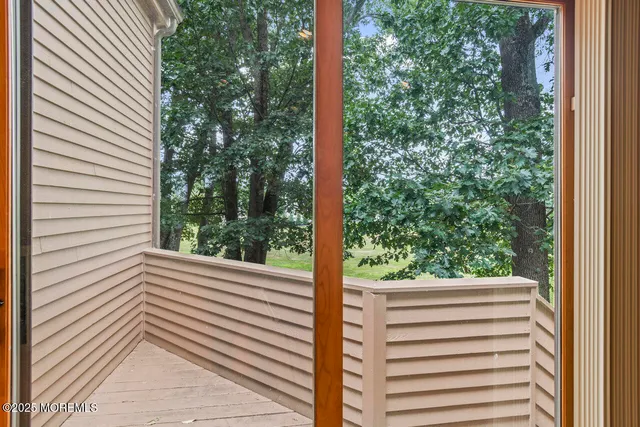 a spacious bedroom with a large bed and a large window