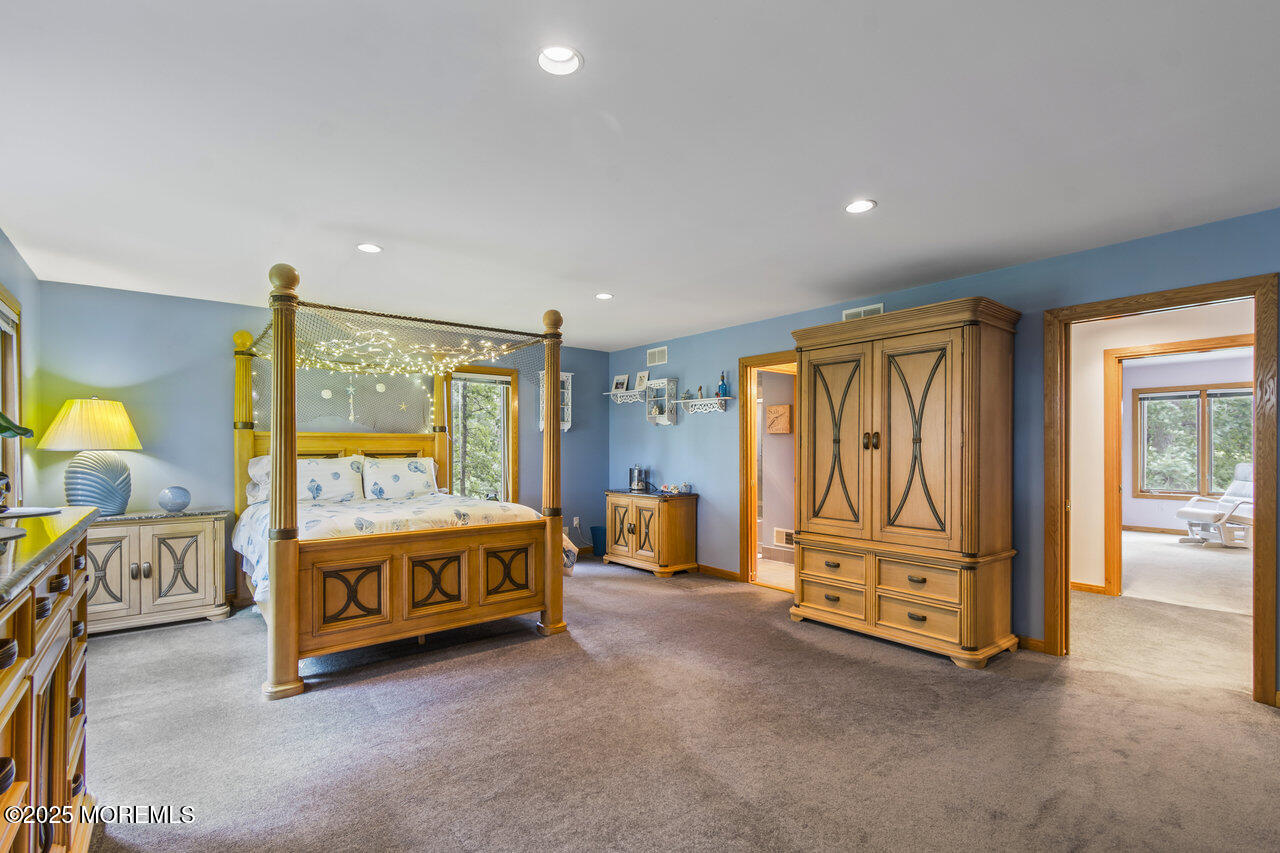 31 Thompson Grove Road Freehold, NJ 07728 - Photo 42 of 54 a living room with furniture and a dresser